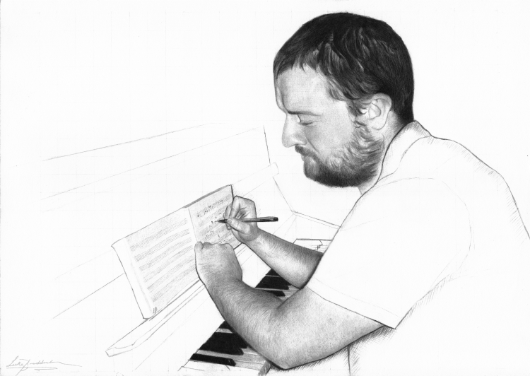 Image of Ben Gaunt writing on manuscript paper