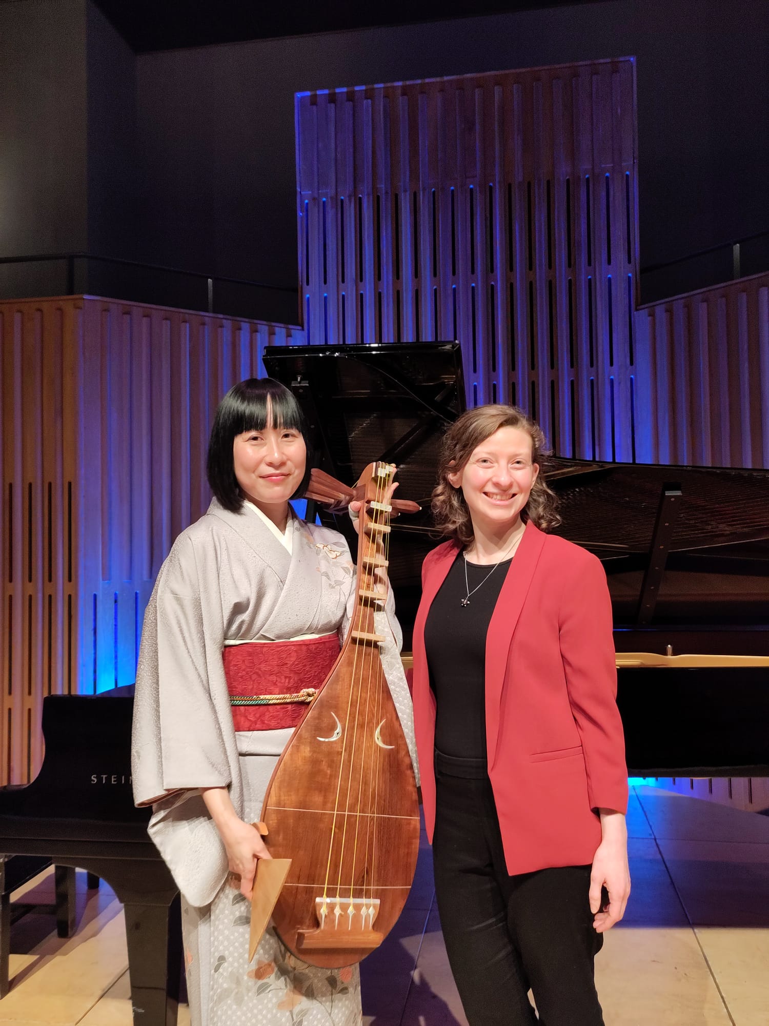 biwa player Akiko Kubota (L) and composer Francesca Le Lohé (R) stand together on stage